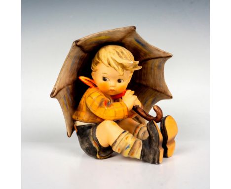 Hand painted in matte finish. Modeled as a young boy seated holding his umbrella. Goebel backstamp. Issued: 20th centuryDimen