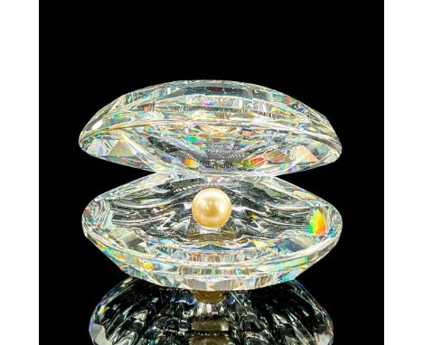 Dazzling clear faceted figure of an open seashell with a faux pearl inside. Swarovski mark. This item has its original box: 5