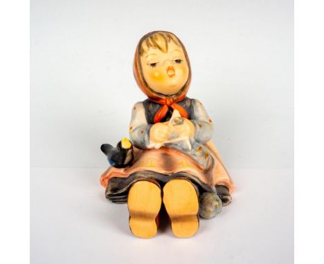 Hand painted porcelain figure. Sitting girl knitting with bird by her side. Goebel backstamp. Artist: M.I. HummelIssued: 1960