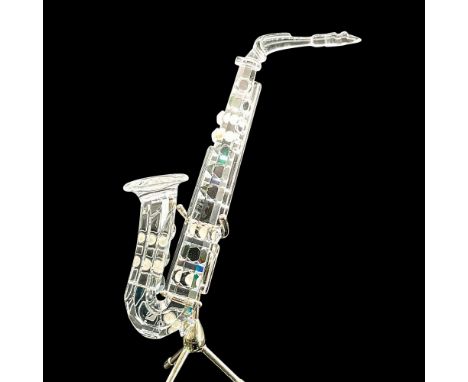 Sparkling clear saxophone with pearlized accents. Swarovski etched mark. This item has its original box 6""H x 3.25""dia. Dim