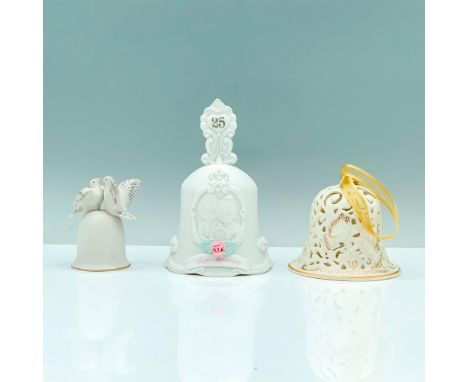 A set of three white dining bells around the theme of marriage. A Wedgwood 2005 bell with two doves in the center with text t