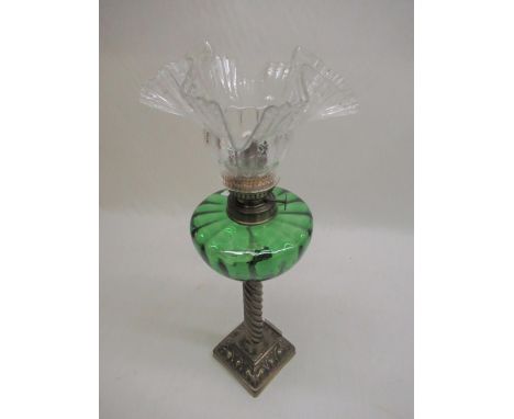 Late C19th - early C20th oil lamp with moulded green glass reservoir and barley twist column on square stepped base with clea