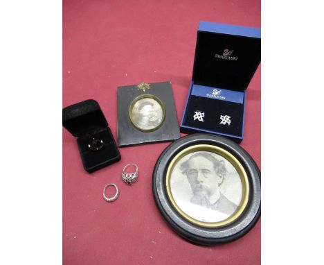 Pair of Swarovski clip earrings, three dress rings, C19th ebonised portrait miniature frame and a circular ebonised frame 