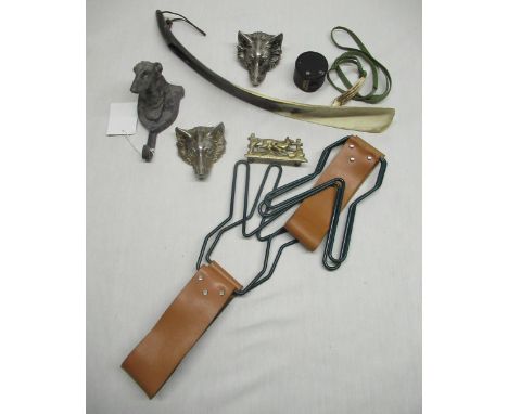 Two game hangers with leather handles, dog head coat hook, horn whistle, shoehorn and other decorative items 