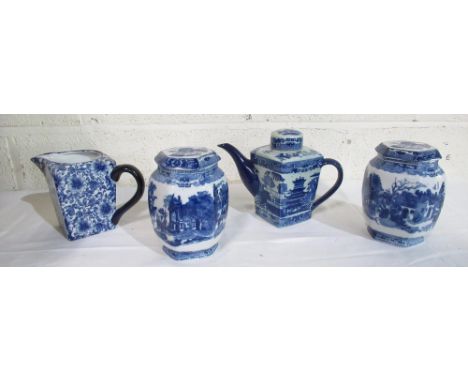 Ringtons tea pot in blue and white willow pattern design, two lidded blue and white jars in cathedral print design and anothe