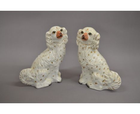 Two ceramic King Charles Spaniels approx 31cm tall. 