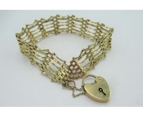 C20th gold six bar gate bracelet with heart shaped padlock clasp stamped 375, weight 7.2grams 