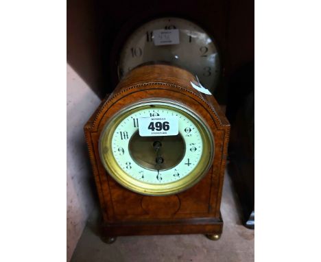 An early 20th Century polished walnut and ebony strung cased break dome-top mantel timepiece with eight day movement - sold w
