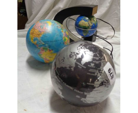 A hovering globe model and two battery operated globes