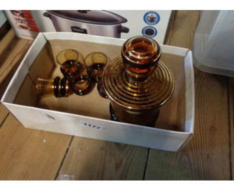 A box containing an Art Deco amber glass licqueur set with gilt banded decoration comprising a decanter and six glasses