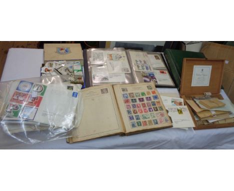 A box containing two stamp albums with hinge mounted and stuck down GB and world stamps including Penny Reds and other Victor