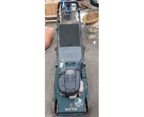 A Hayter Harrier 48 petrol lawn mower, with stripe roller and grass box