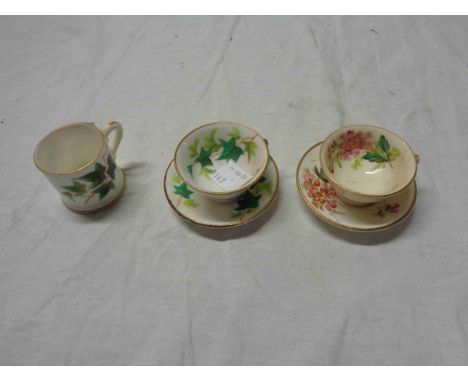 Two 19th Century miniature porcelain cups and saucers with hand painted floral and ivy decoration - sold with a similar mug