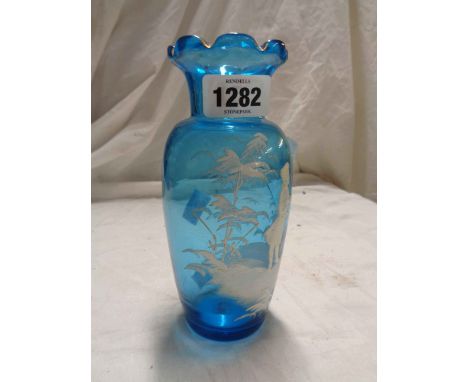A 19th Century blue glass vase with Mary Gregory style enamel decoration