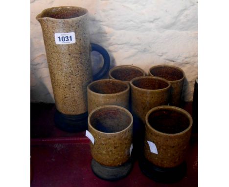 A vintage Studio Pottery lemonade set comprising jug and six goblets
