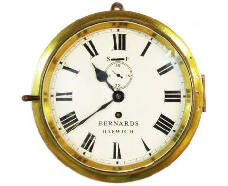 A vintage brass cased bulkhead timepiece with printed dial marked for Bernards, Harwich and subsidiary seconds dial, with eig