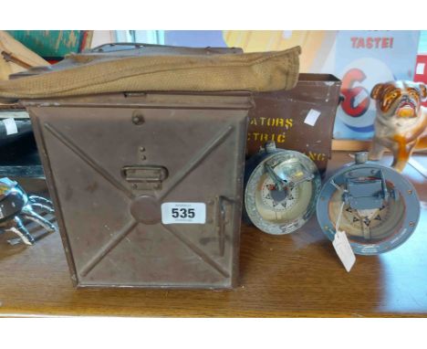 A military signalling lamp - sold with an old metal ammunition tin and two handheld compasses