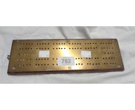 A brass mounted wooden cribbage board