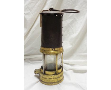 An old miner's lamp marked for 'Thomas and Williams Aberdare'