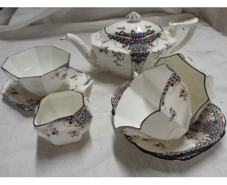 An early 20th Century Shelley porcelain 'tea for two' set' comprising teapot, milk, sugar, two cups and saucers and a small p