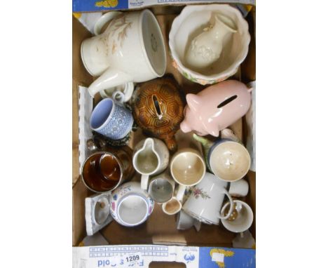 A box containing a quantity of ceramics including money boxes, Hornsea pottery, etc.