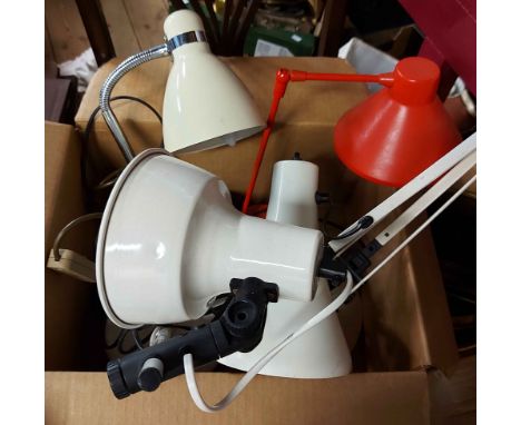 A box containing four vintage style desk lights