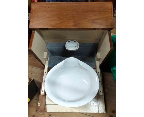 An oak cased ship's wash basin with fall-front enclosing a ceramic bowl and soap dish