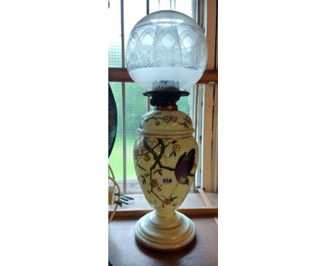 A large decorative hand painted opaque glass oil lamp with shade
