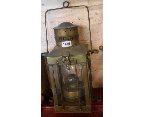 A vintage Davey &amp; Co. brass ship's hanging lantern with glass panels, internal oil lamp and brass frame
