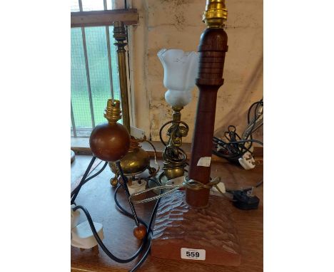 A brass cherub lamp - sold with three others