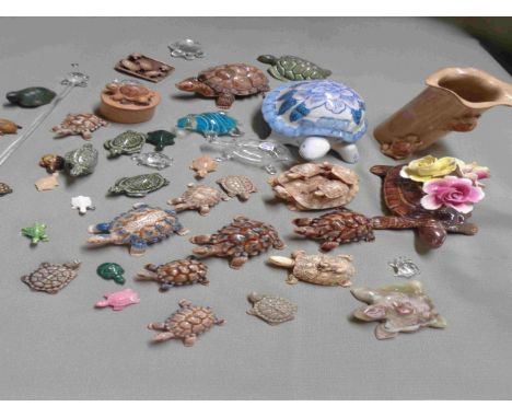A box containing a quantity of ceramic, glass and other tortoise models