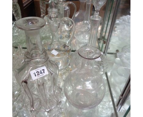 Three 19th Century glass decanters - sold with a similar carafe