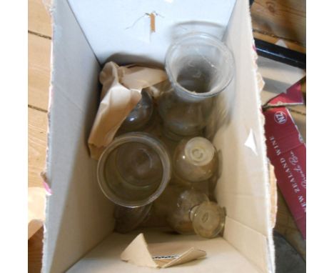 A box containing a quantity of vintage pharmaceutical glassware