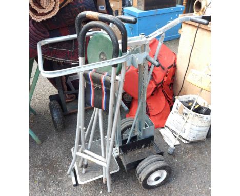 A metal garden caddy on wheels
