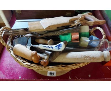 A basket containing various items of kitchenalia including glass rolling pin, butter pats, bread board, etc.