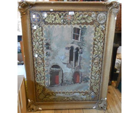 A large gilt framed tapestry picture entitled 'Casa de Christovao Colombo, Funchal, Madeira', depicting the house within a de