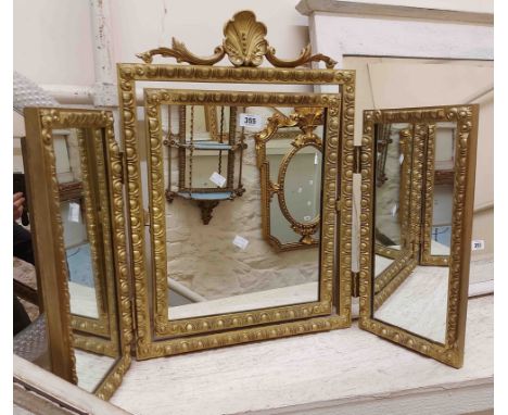 A vintage gilt framed triple dressing table mirror with pierced pediment and decorative border