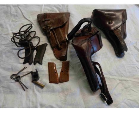 A WWI leather German holster, another holster marked Gustav Reinhardt Berlin 1915 and a WWII German officers holster - sold w