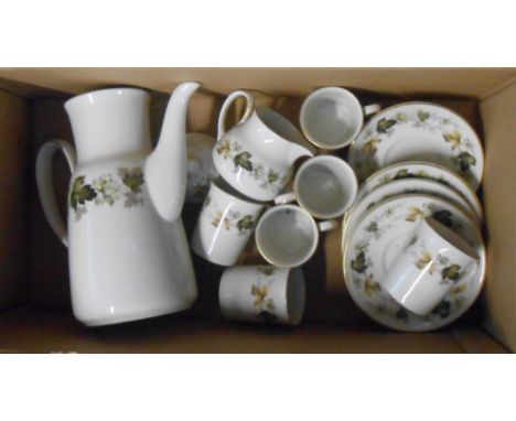 A box containing a Royal Doulton bone china part coffee set, decorated in the Larchmont pattern comprising coffee pot, cream 