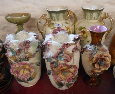 A pair of late 19th Century ceramic vases with applied encrusted flower decoration on a 'clay gravel' ground - sold with anot