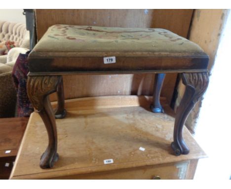 A 19th Century mahogany dressing stool with remains of tapestry upholstered drop-in seat, set on acanthus cabriole legs with 