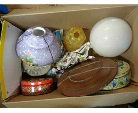 A box containing a quantity of collectable items including 1920's glass lamp shade, other shades, tins, etc.