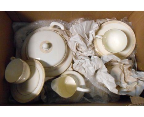 A box containing a quantity of Royal Doulton bone china tableware, decorated in the Cassandra pattern including tureens, cups