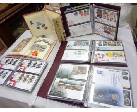 Three Royal Mail First Day Covers ring bound albums containing a collection of FDCs - all 21st Century - sold with another co