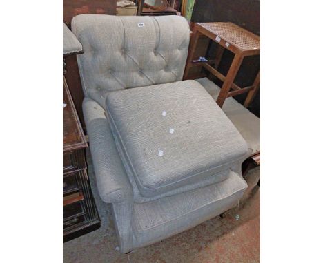 A low armchair with later button back machine oatmeal tapestry upholstery, set on turned front legs and brass casters - sold 