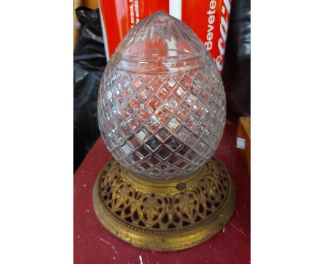 A vintage brass and cut glass ceiling light