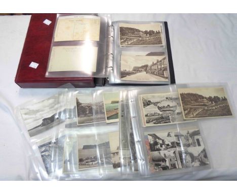 A box sleeved red ring bound album containing a collection of early 20th Century and other Shaldon interest postcards, mainly