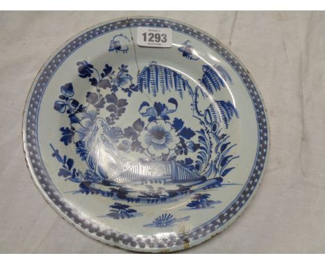 An 18th Century English delftware plate with blue painted decoration - a/f