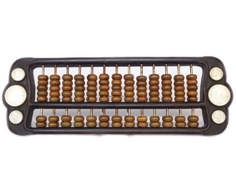 A Chinese abacus, set with coins