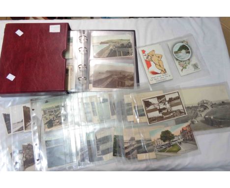 A box sleeved red ring bound album containing a collection of early 20th Century and other Teignmouth interest postcards, mai